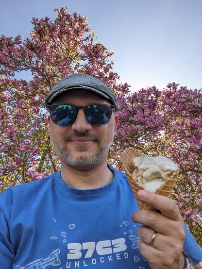 Me with sunglasses having my first ice of the season.

Background: sun, blue sky, magnolia.

Purkarthofer, Fernitz.

My recommendation: Muskateller Sorbet. 🤤
