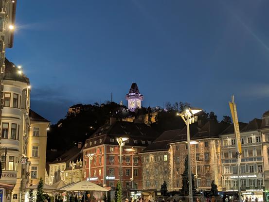 View to Schlossberg with Uhrturn (clock tower) from main square at dawn