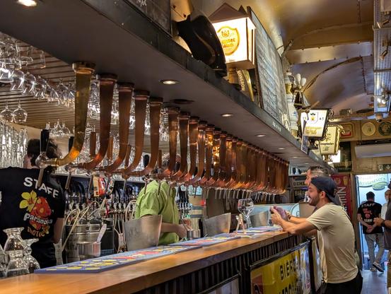 many beer taps in a row of Delirium Café