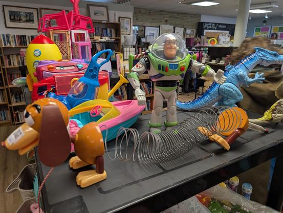 Slinky and Buzz Lightyear figures from the Toy Story movies on a store shelf